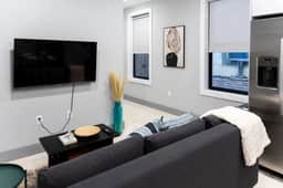 Modern 2BR • Quick NYC Access + Free Parking - Image 2